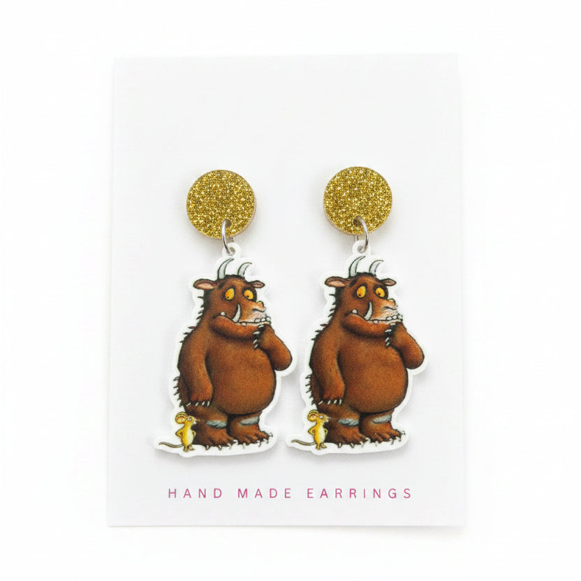 Handmade earrings with a cartoon character on a &