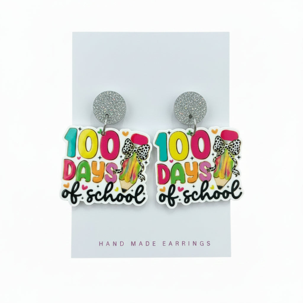 100 Days of School earrings on a card with &
