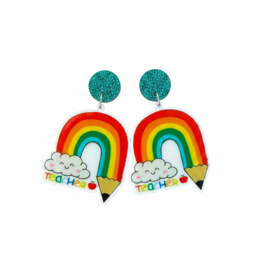 Pair of rainbow-themed earrings on a &