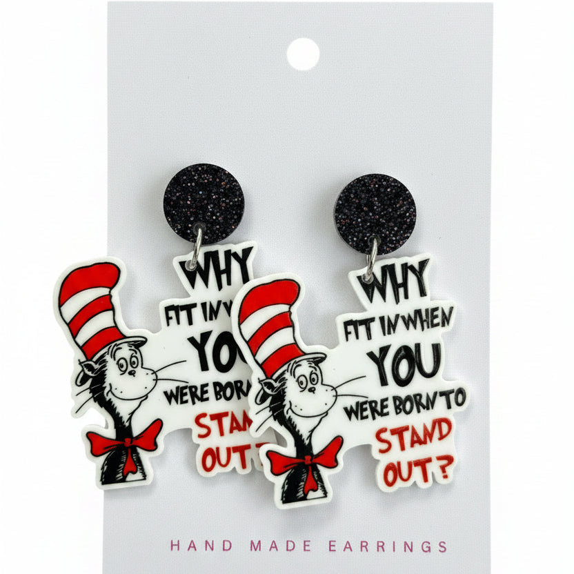 Earrings with Dr. Seuss character packaging on a grass background