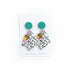 Turquoise glitter earrings on a card with &