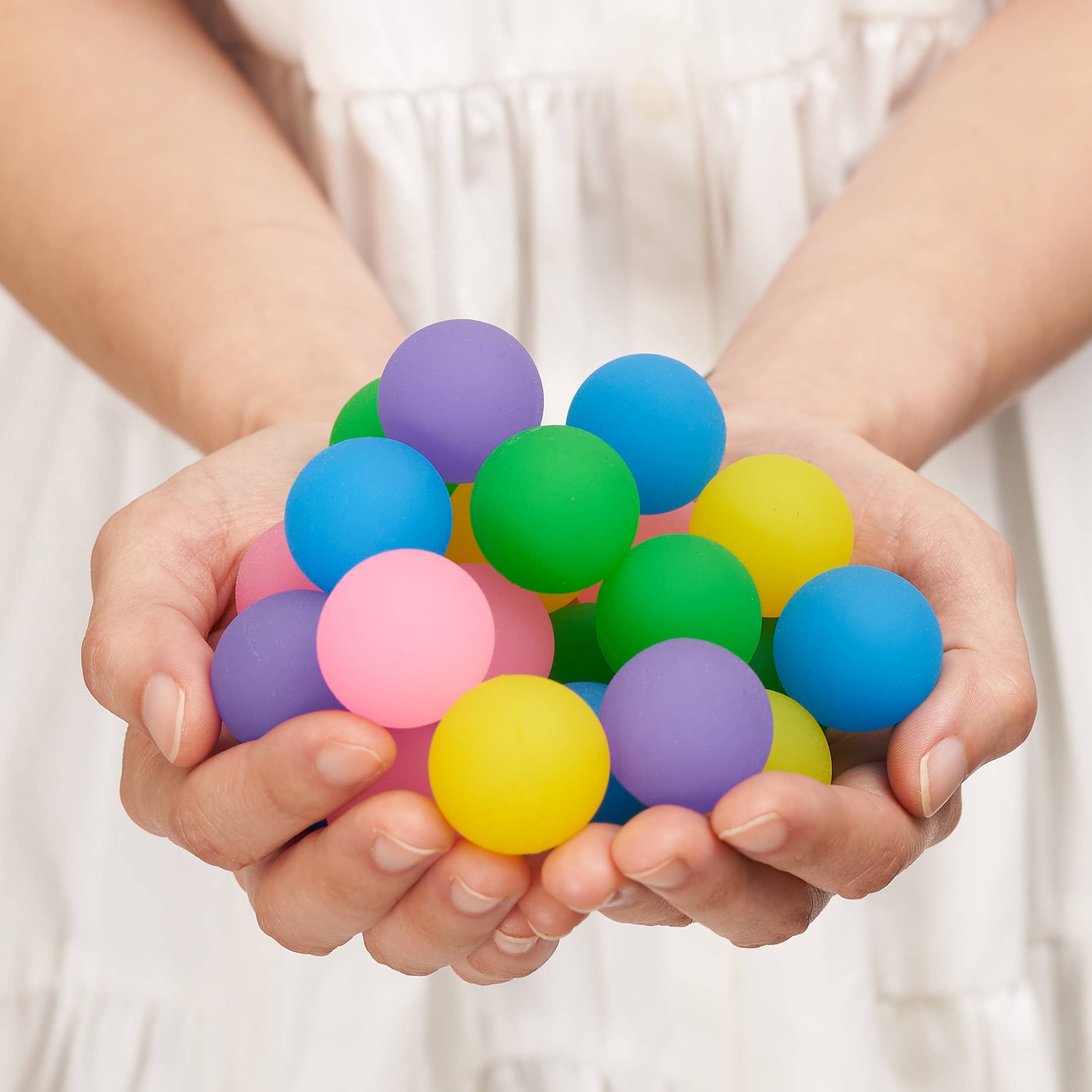 70 Mini Neon Coloured Bouncing Balls in a Tub